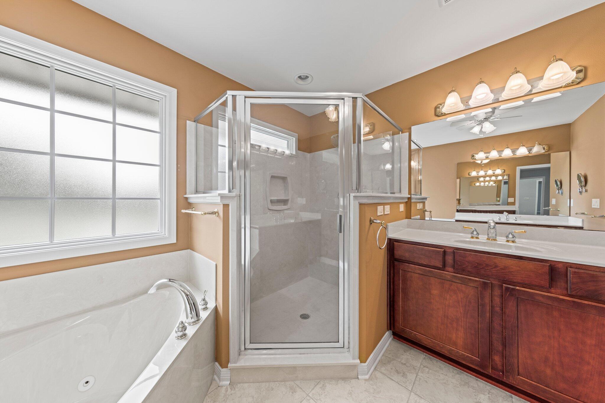 20 Maple Avenue Shalimar, FL 32579 - Photo 18 of 55 a bathroom with a bathtub and a shower