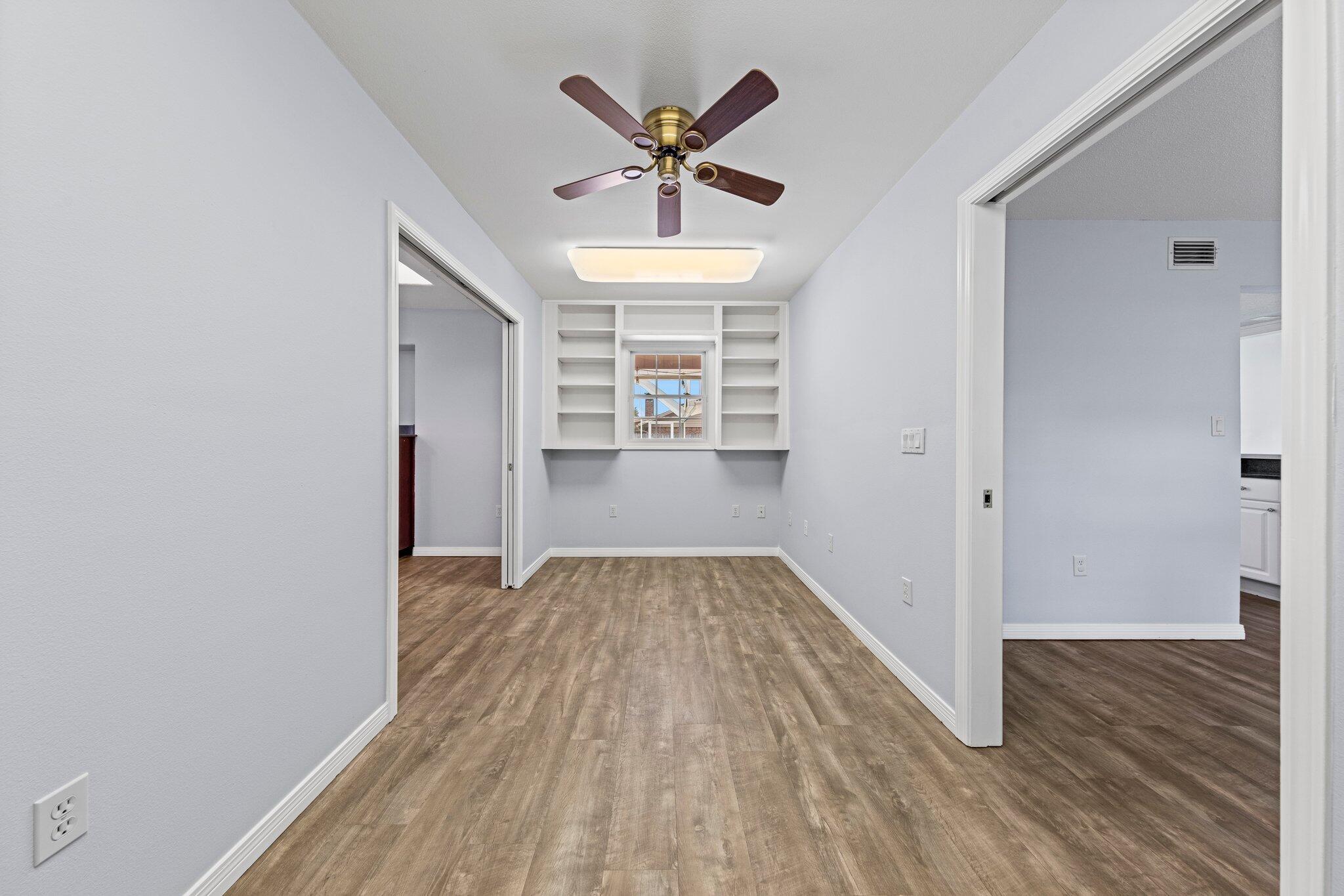 20 Maple Avenue Shalimar, FL 32579 - Photo 24 of 55 wooden floor in an empty room with a window