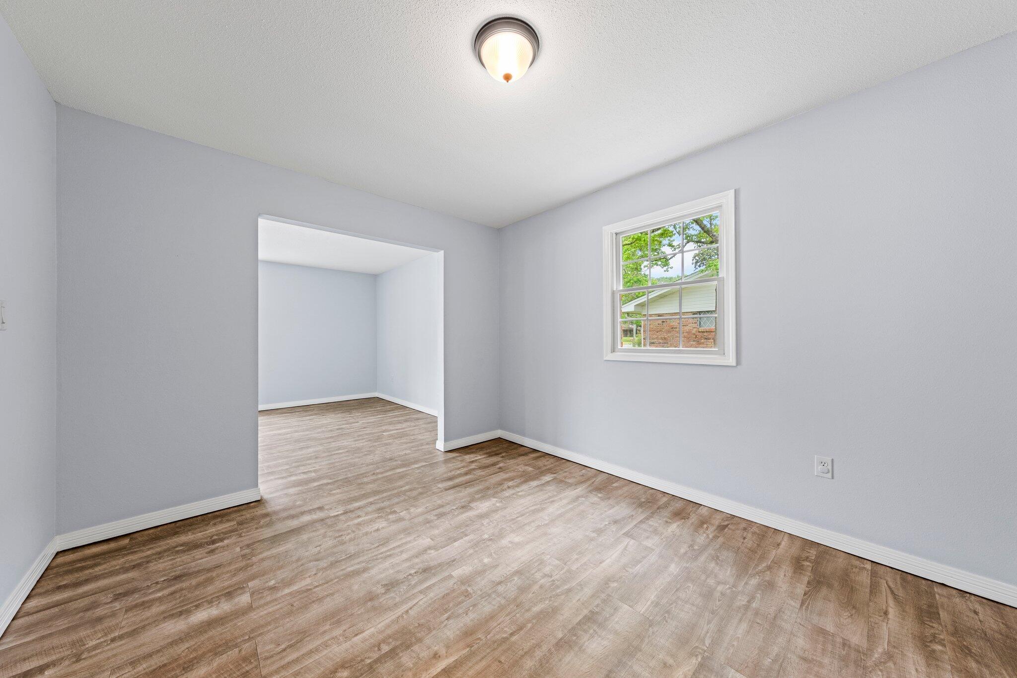 20 Maple Avenue Shalimar, FL 32579 - Photo 27 of 55 an empty room with wooden floor and windows