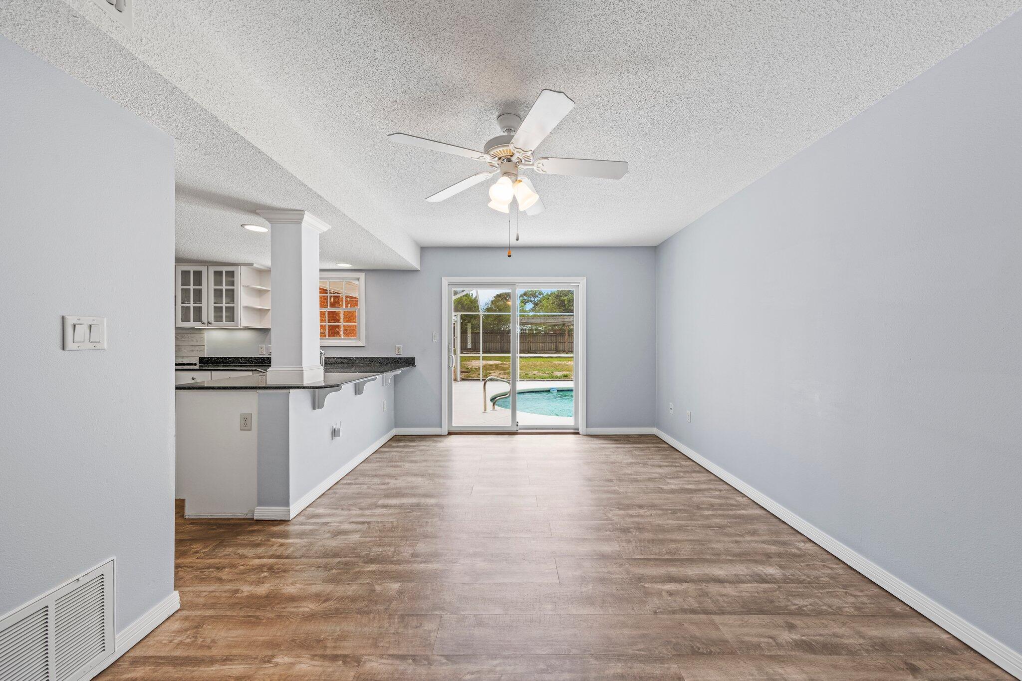 20 Maple Avenue Shalimar, FL 32579 - Photo 30 of 55 wooden floor in an empty room with a window