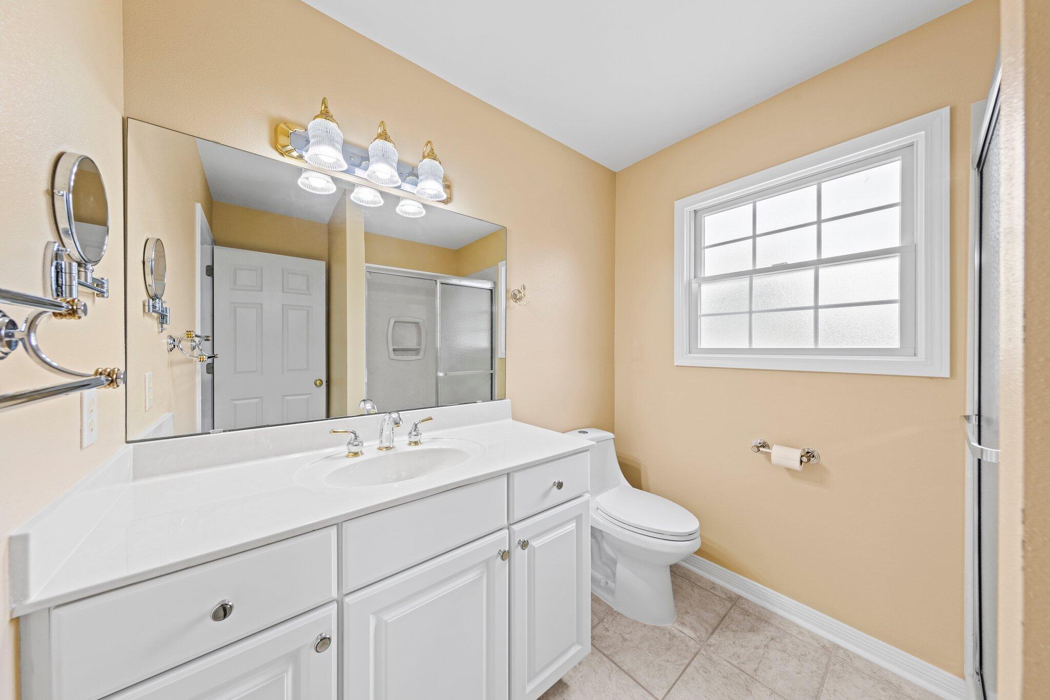 20 Maple Avenue Shalimar, FL 32579 - Photo 35 of 55 a bathroom with a double vanity sink mirror and