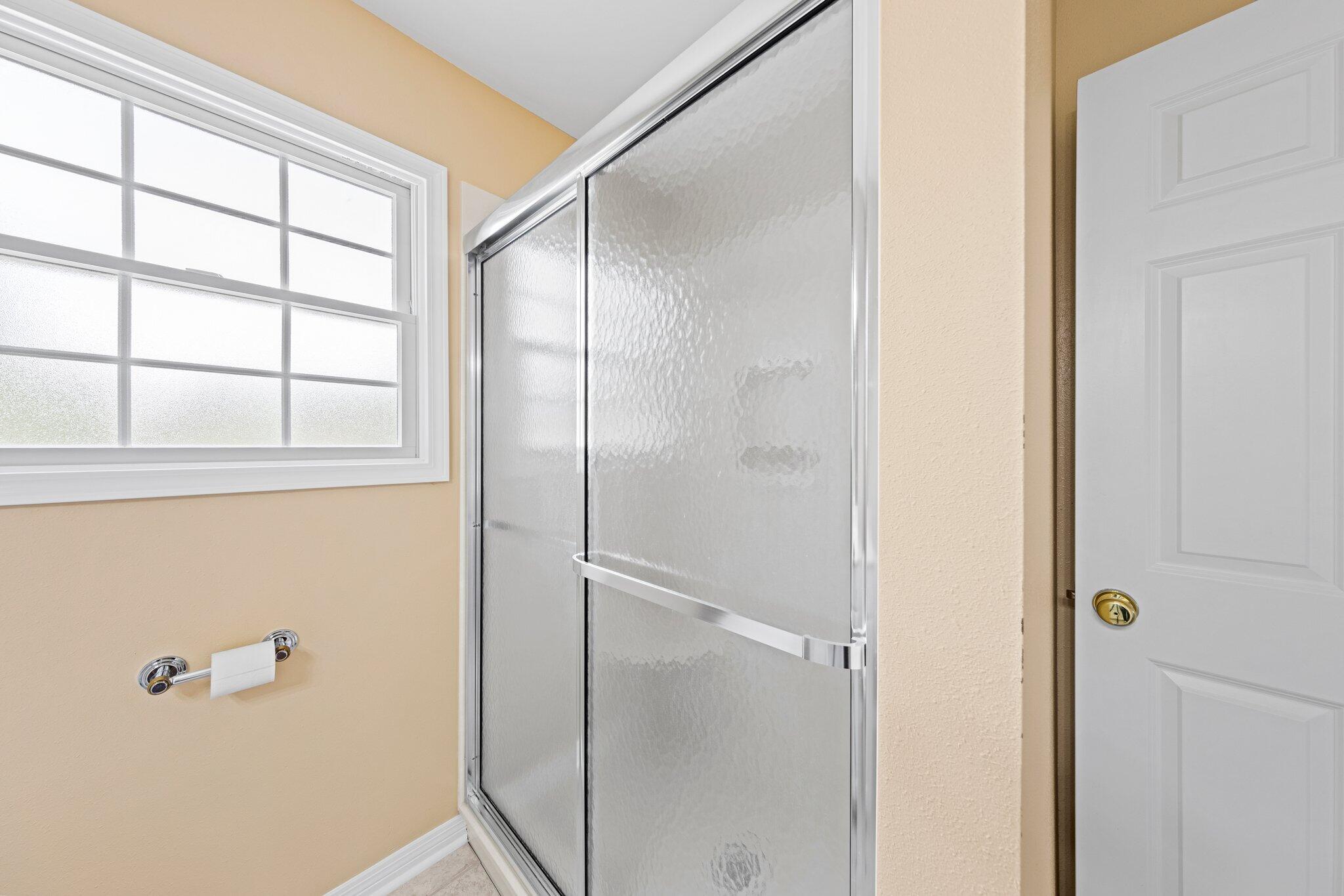 20 Maple Avenue Shalimar, FL 32579 - Photo 36 of 55 a bathroom with a glass shower door