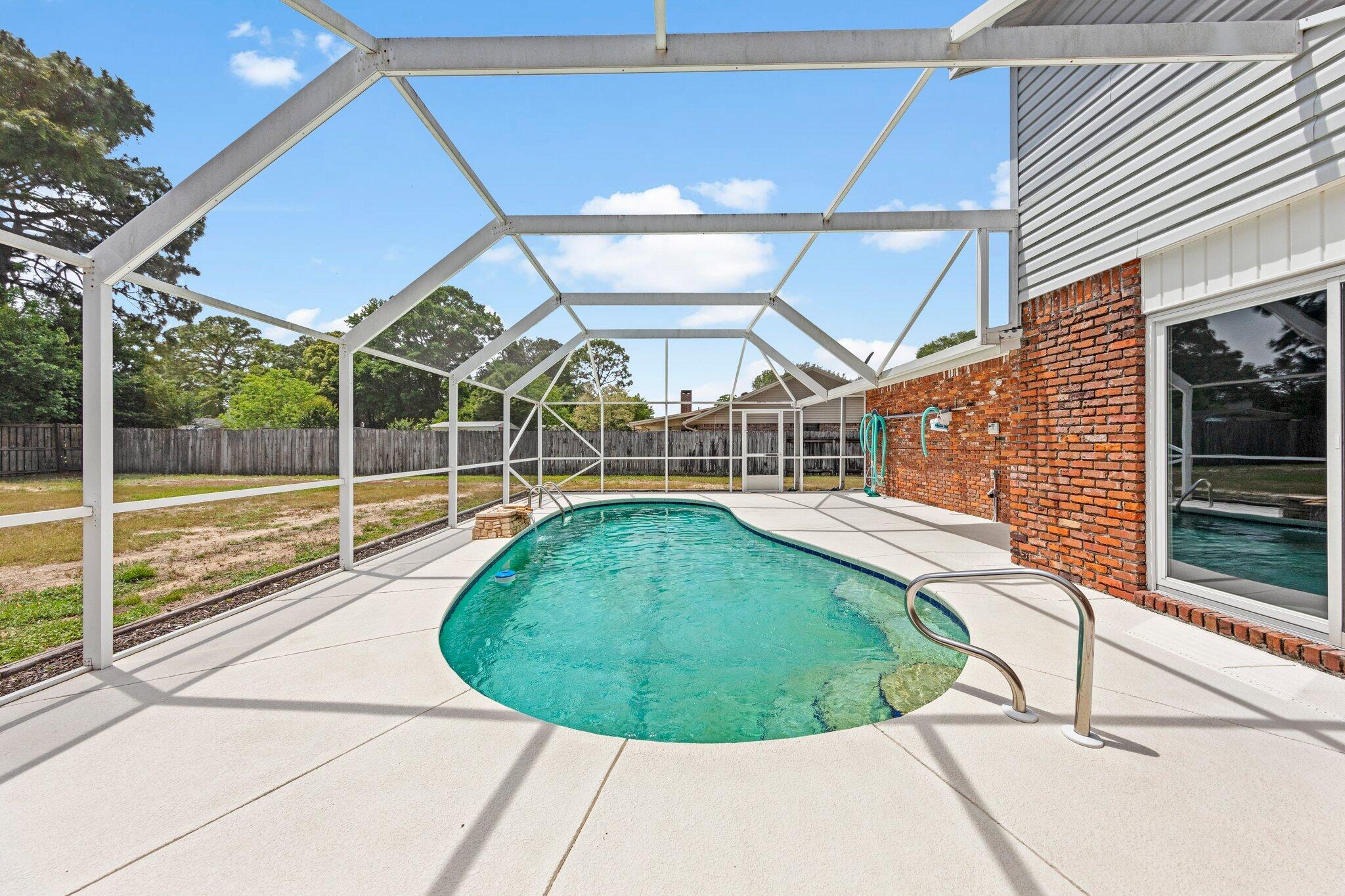 20 Maple Avenue Shalimar, FL 32579 - Photo 48 of 55 a view of a swimming pools under an umbrella