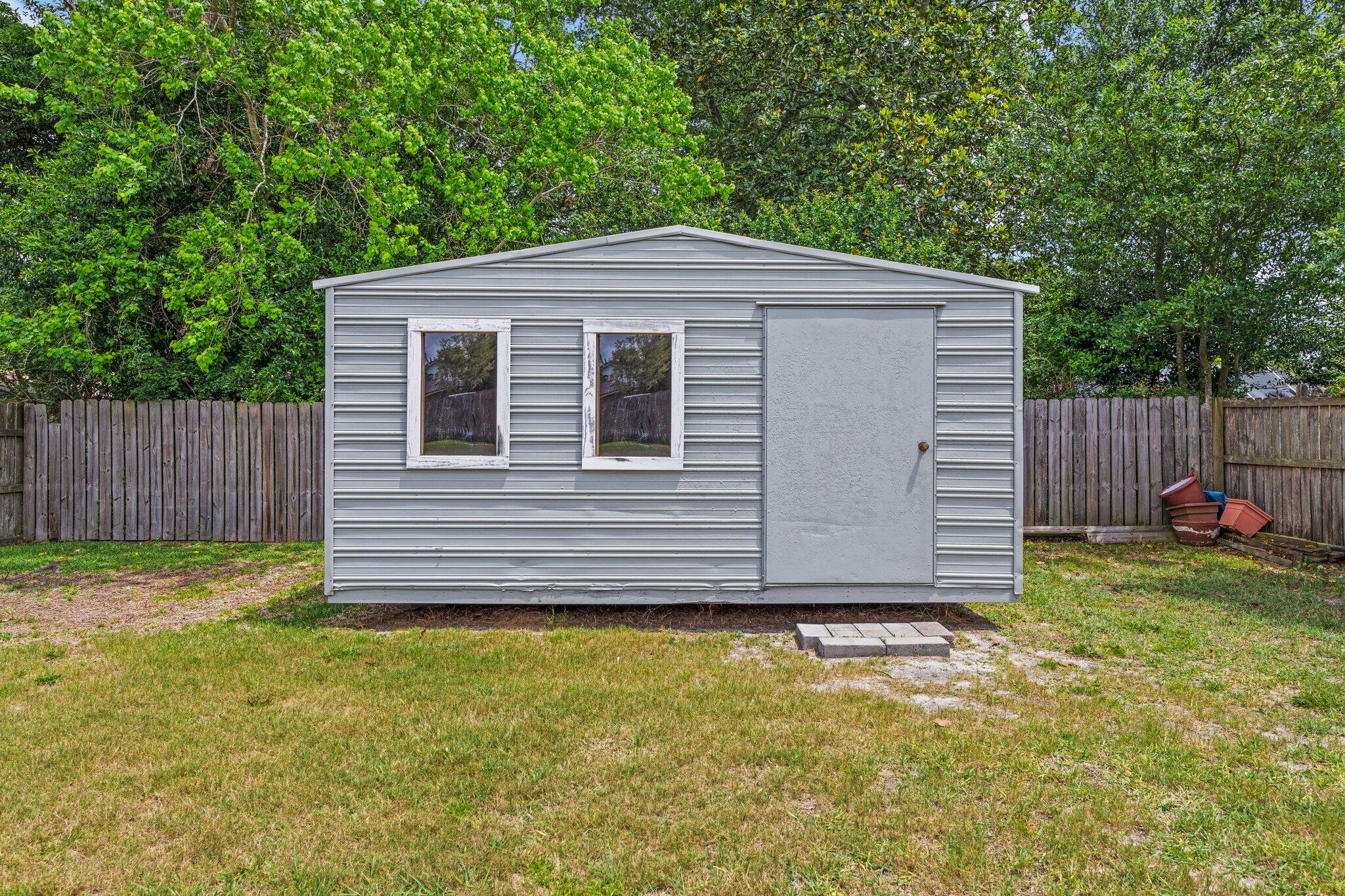 20 Maple Avenue Shalimar, FL 32579 - Photo 51 of 55 a view of a house with a yard