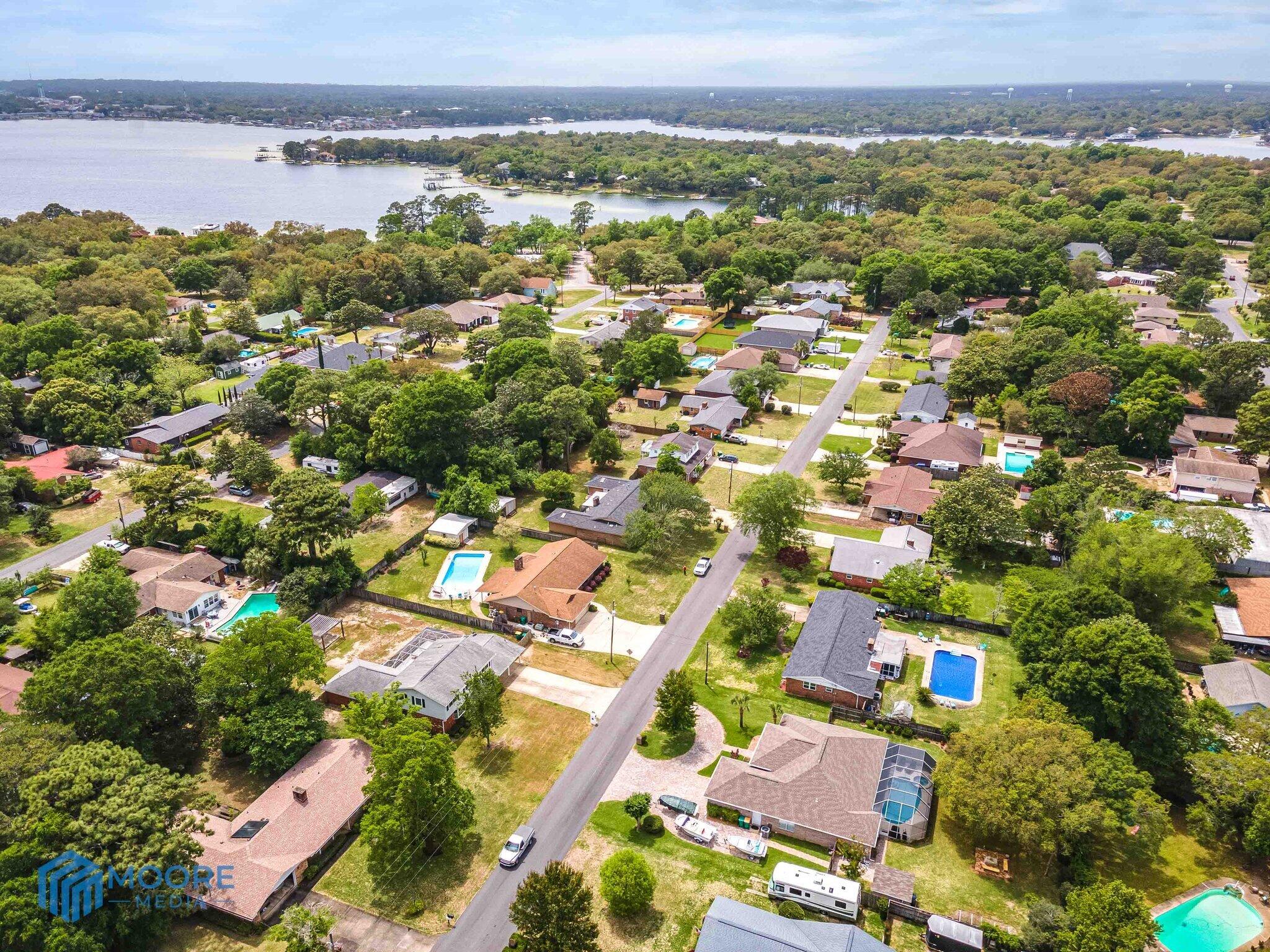 20 Maple Avenue Shalimar, FL 32579 - Photo 55 of 55 an aerial view of residential houses with outdoor space and swimming pool