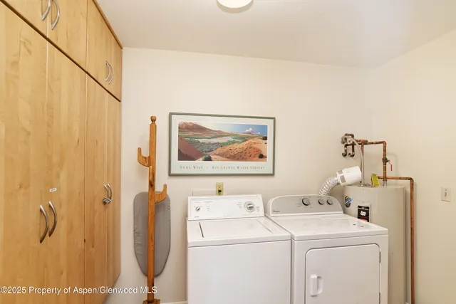 a view of bathroom with a washer and dryer