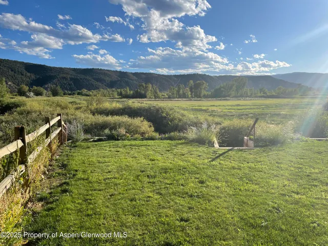 a view of a lake from a yard