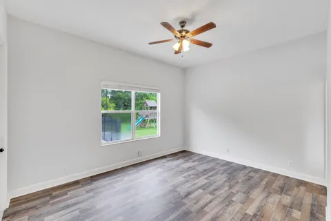 a kitchen with stainless steel appliances granite countertop a stove top oven a sink a refrigerator and a granite counter tops