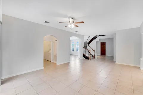 a aerial view of a house with a yard table and chairs