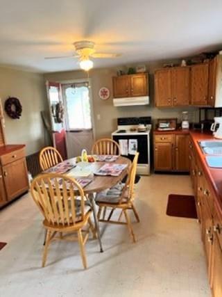 107 Oliphant Road Uniontown, PA 15401 - Photo 6 of 14 a open kitchen with stainless steel appliances granite countertop a stove a sink a dining table and chairs