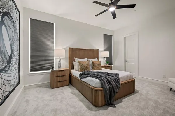 a spacious bedroom with a bed and window
