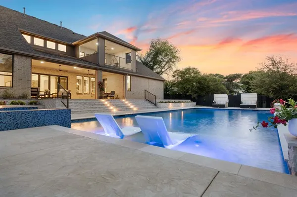 a view of a house with swimming pool