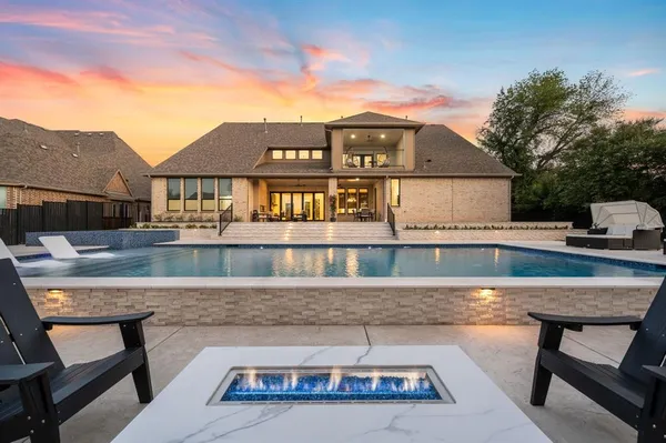 a house view with a seating space and a patio