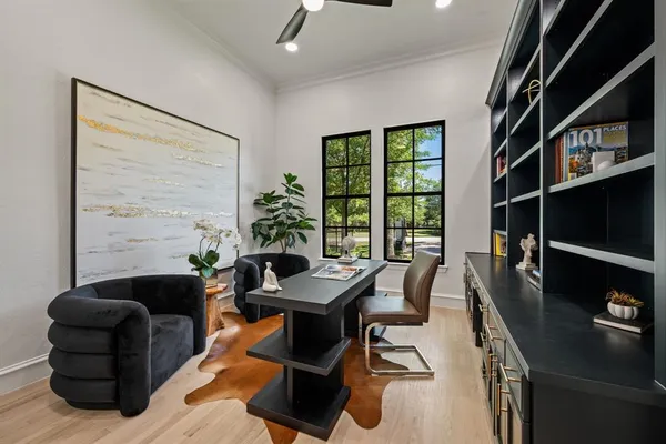 a living room with furniture and a floor to ceiling window