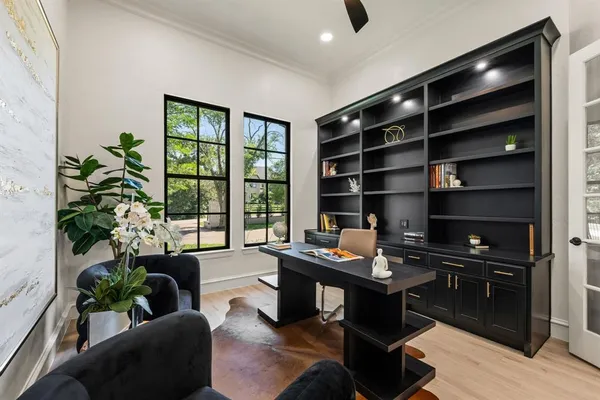 a living room with furniture potted plant and a window