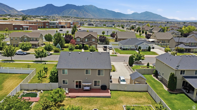 592 West 650 South Springville, UT 84663 - Photo 29 of 33 Expansive property featuring a multi-level deck, fenced backyard with a pond, and a detached shed