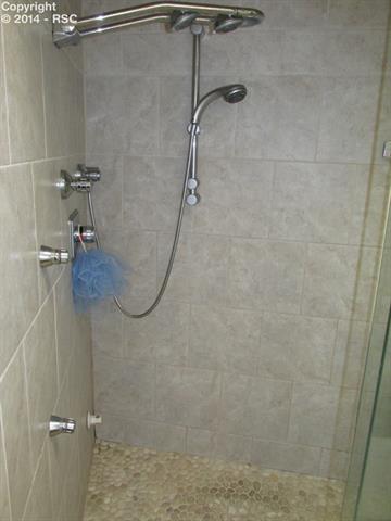 52 Upland Road Colorado Springs, CO 80906 - Photo 4 of 14 Master shower with multiple shower heads and steam unit
