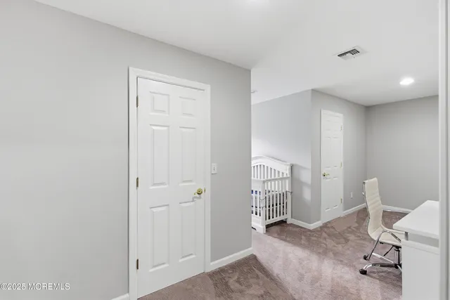 a view of a storage & utility room with closet window
