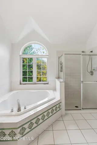 a bath tub sitting next to a window