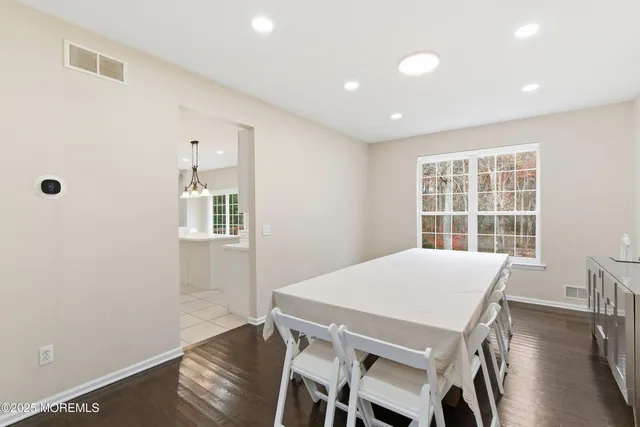 a view of a dining room with furniture and window