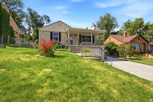 1341 29th Street Ogden, UT 84403 - Photo 2 of 37 Front exterior featuring a covered porch, established landscaping, and a concrete driveway