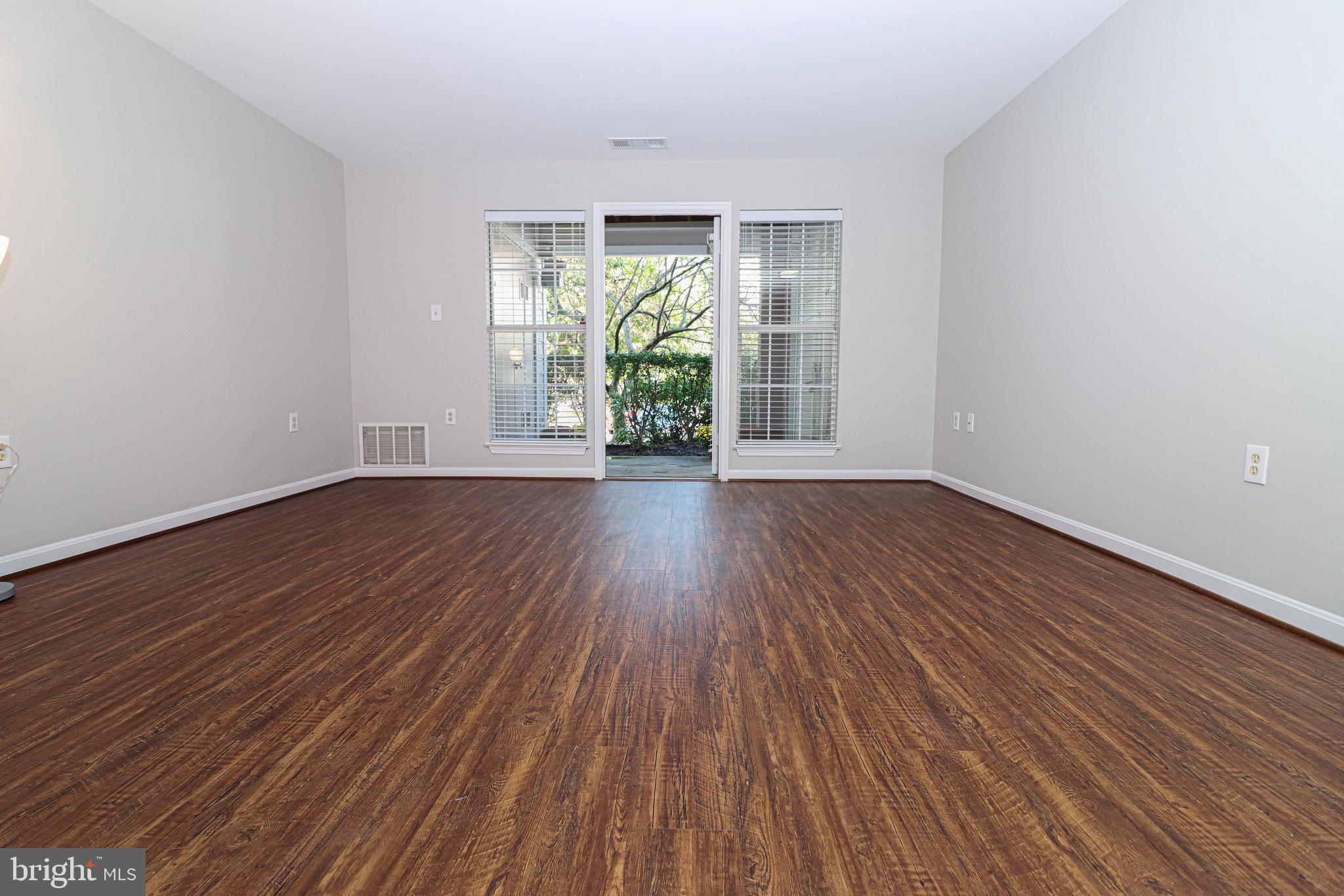 21012 Timber Ridge Terrace, Unit 102 Ashburn, VA 20147 - Photo 3 of 27 Spacious Freshly Painted Living Room