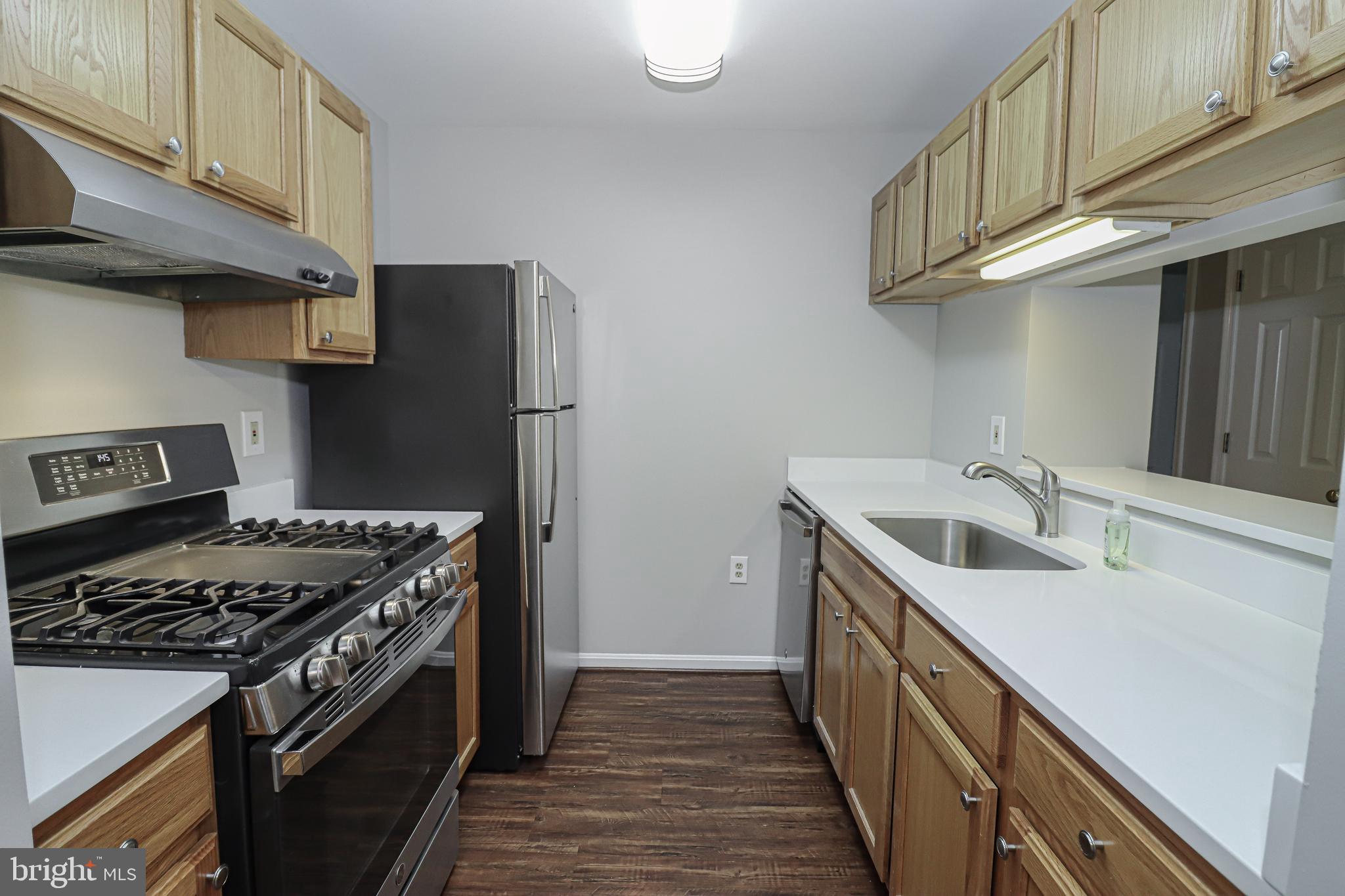 21012 Timber Ridge Terrace, Unit 102 Ashburn, VA 20147 - Photo 8 of 27 Kitchen with New Stainless Steel Appliances
