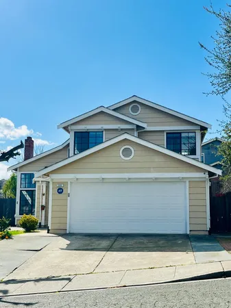 a front view of a house with a garage