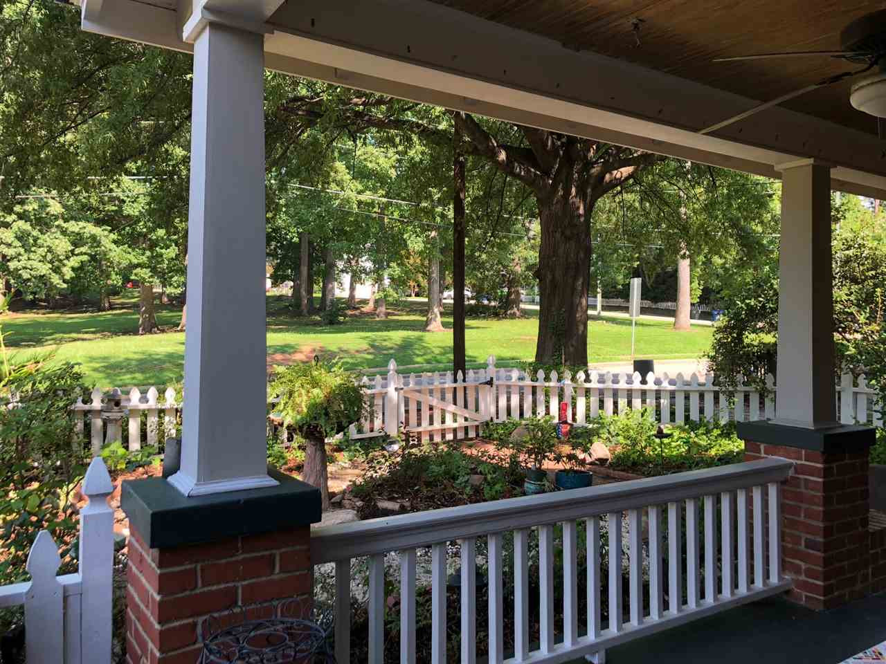 The park-like Oak grove across the street is part of the Project Enlightenment School.