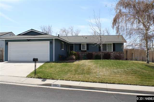3985 Belmore Way Reno, NV 89503 - Photo 1 of 13 front view of house with a yard