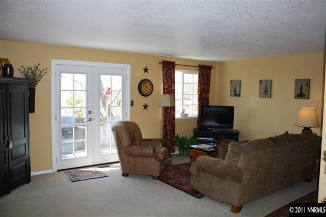 3985 Belmore Way Reno, NV 89503 - Photo 3 of 13 a living room with furniture and a flat screen tv