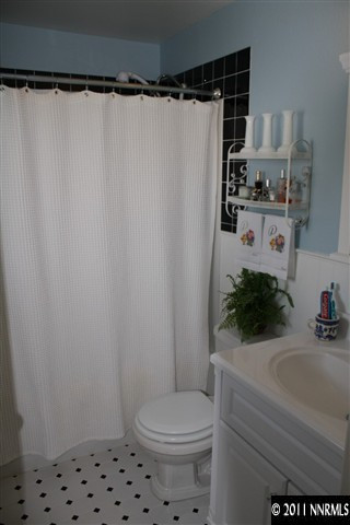 3985 Belmore Way Reno, NV 89503 - Photo 7 of 13 a bathroom with a sink toilet and shower