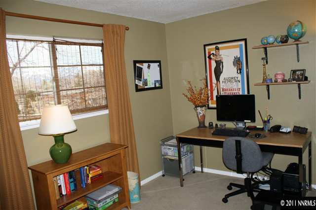 3985 Belmore Way Reno, NV 89503 - Photo 8 of 13 a view of a workspace with furniture and a window
