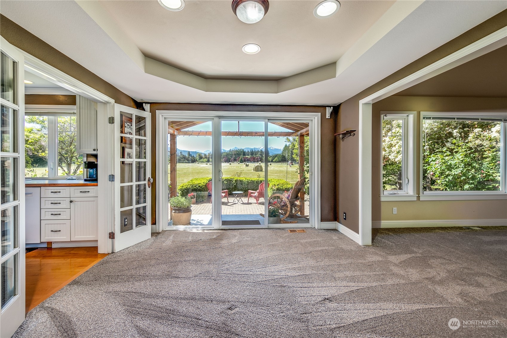 174 Lot 9&10 Knutsen Farm Road Sequim, WA 98382 - Photo 11 of 40 a spacious bedroom with a large bed and a large window