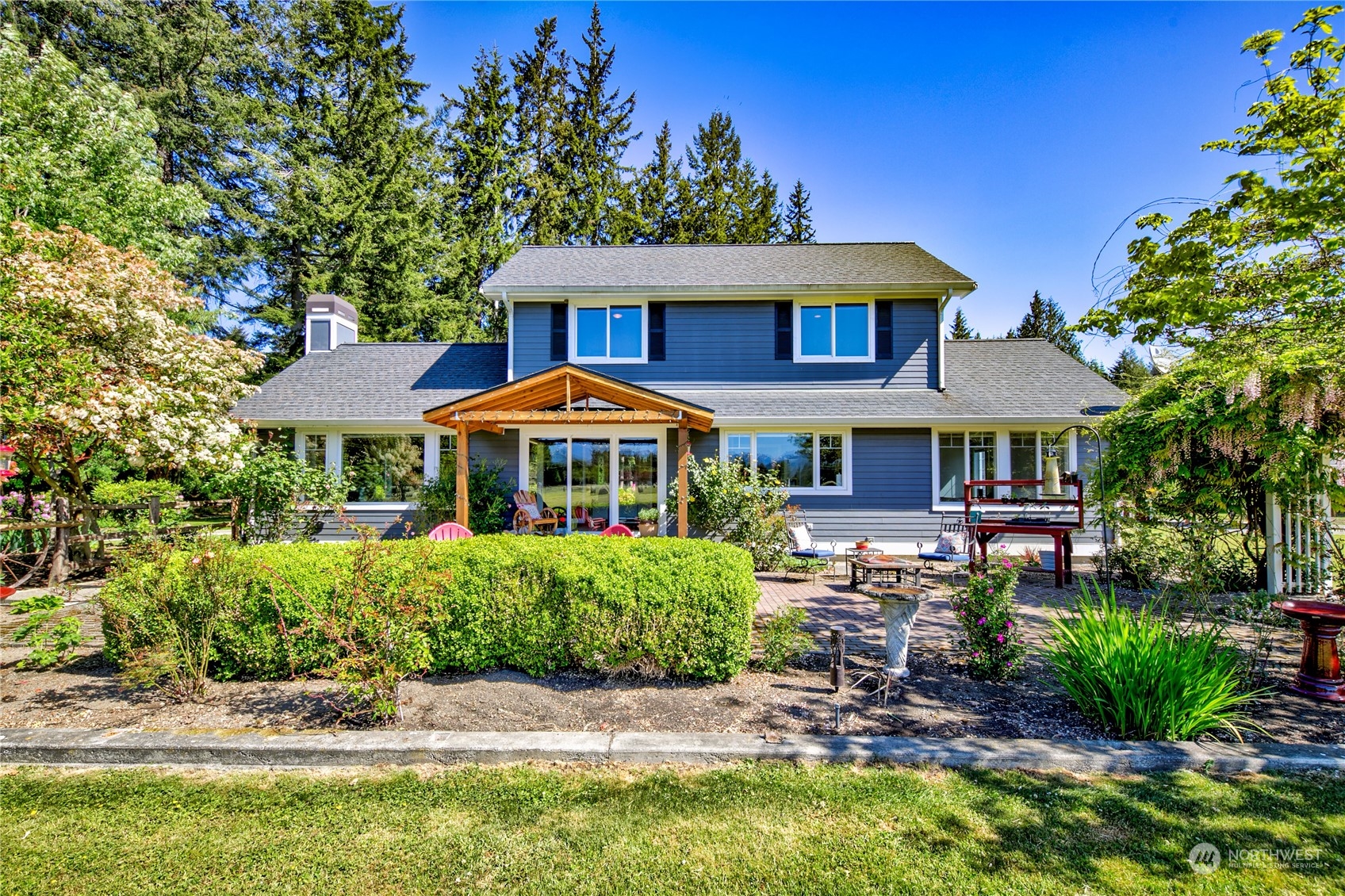 174 Lot 9&10 Knutsen Farm Road Sequim, WA 98382 - Photo 2 of 40 a front view of a house with garden