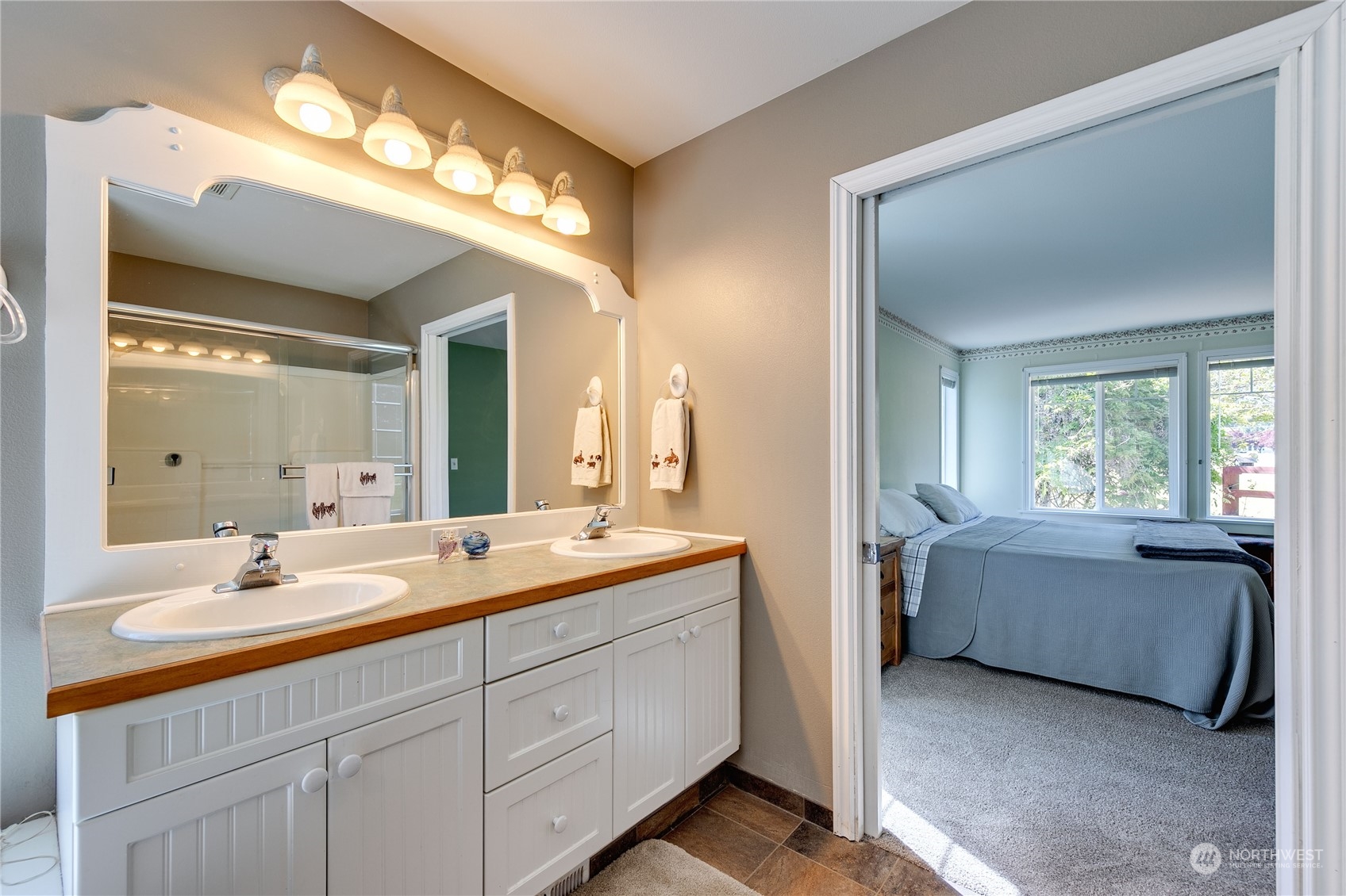 174 Lot 9&10 Knutsen Farm Road Sequim, WA 98382 - Photo 25 of 40 a bathroom with a double vanity sink and a mirror