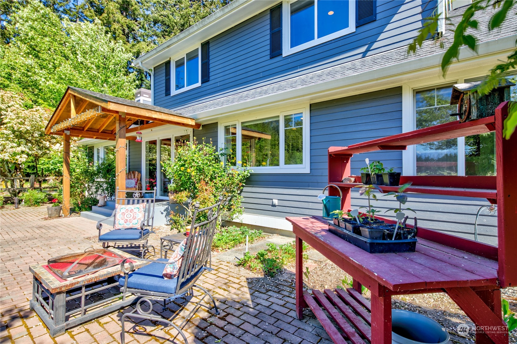 174 Lot 9&10 Knutsen Farm Road Sequim, WA 98382 - Photo 31 of 40 a backyard of a house with seating space