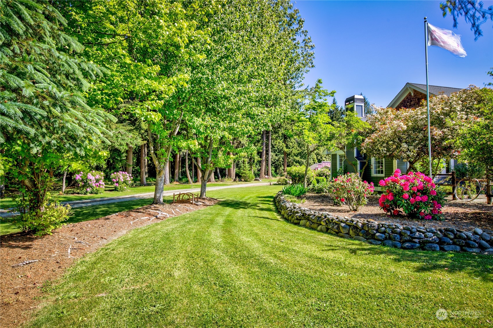 174 Lot 9&10 Knutsen Farm Road Sequim, WA 98382 - Photo 5 of 40 a view of a garden with flowers and trees