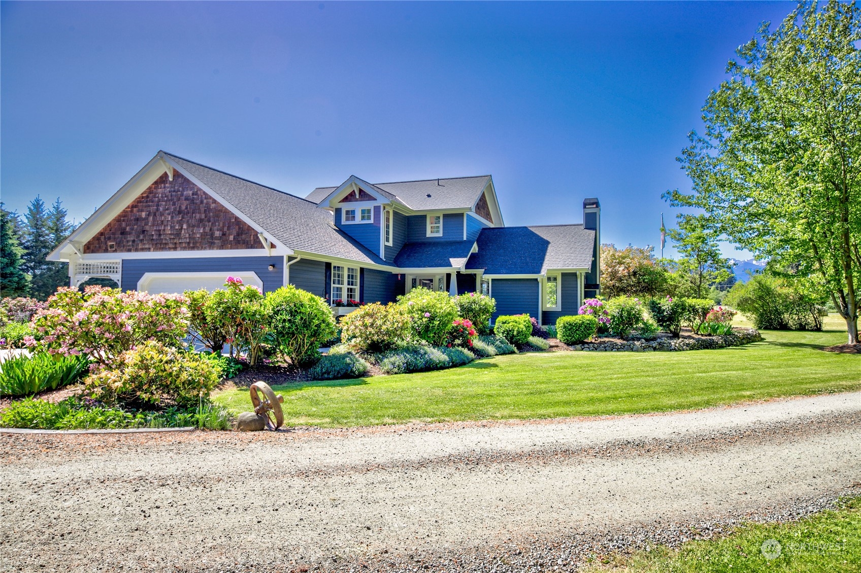 174 Lot 9&10 Knutsen Farm Road Sequim, WA 98382 - Photo 7 of 40 a front view of a house with a yard and a garage