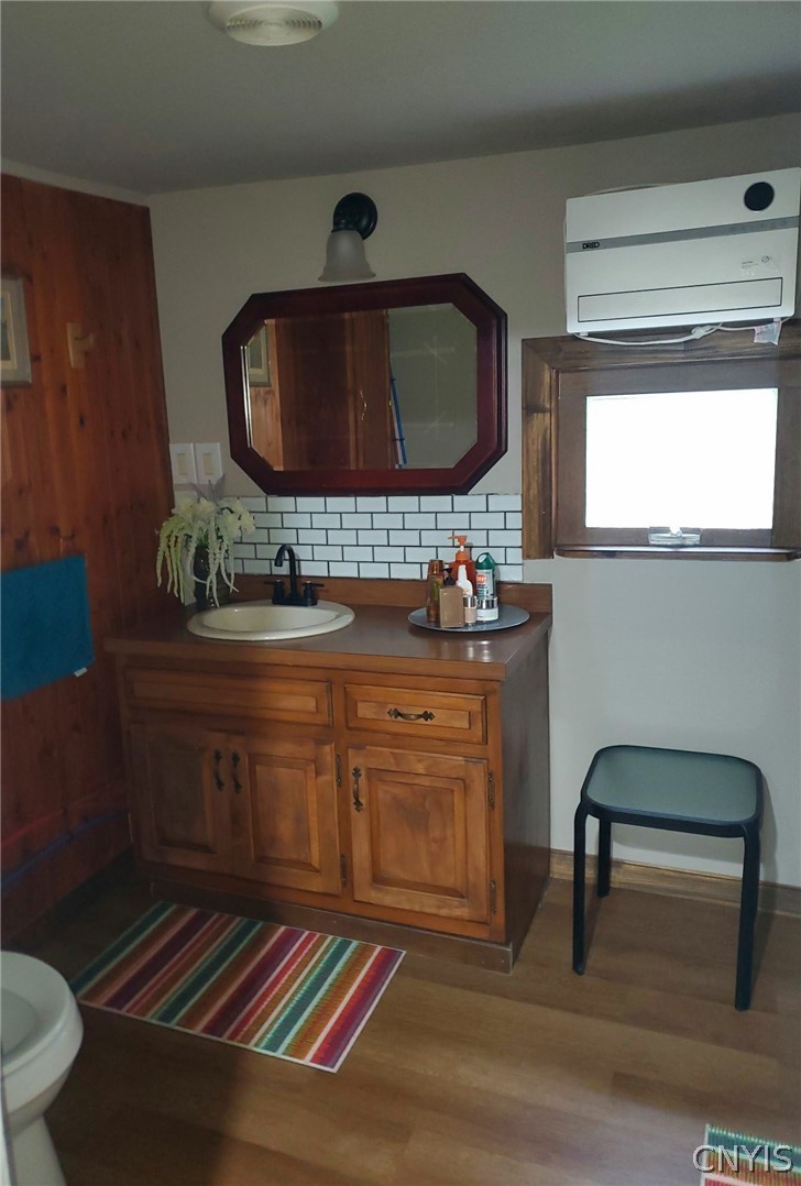 1053 Grant Road Russia, NY 13324 - Photo 20 of 47 Warm wood paneling and a classic vanity define thi