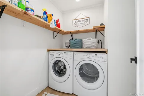 a bathroom with a toilet a sink a vanity and mirror