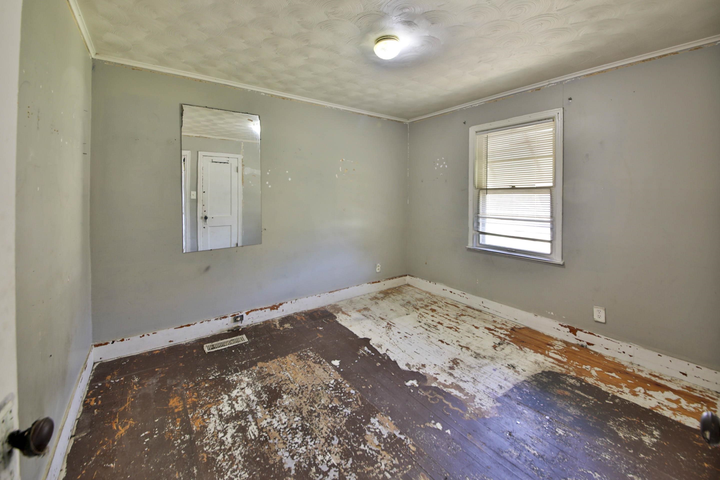 322 Highland Street Ripley, TN 38063 - Photo 10 of 12 Spare room featuring ornamental molding and baseboards