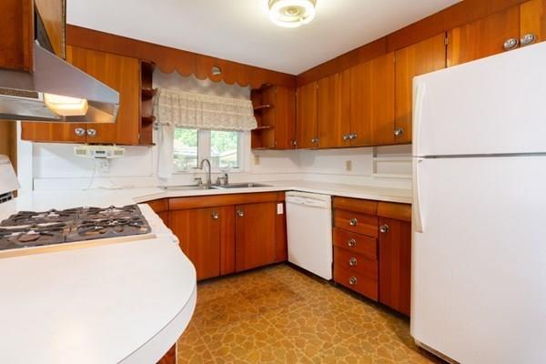 23 Girdler Road Marblehead, MA 01945 - Photo 15 of 36 a kitchen with a white cabinets and white appliances