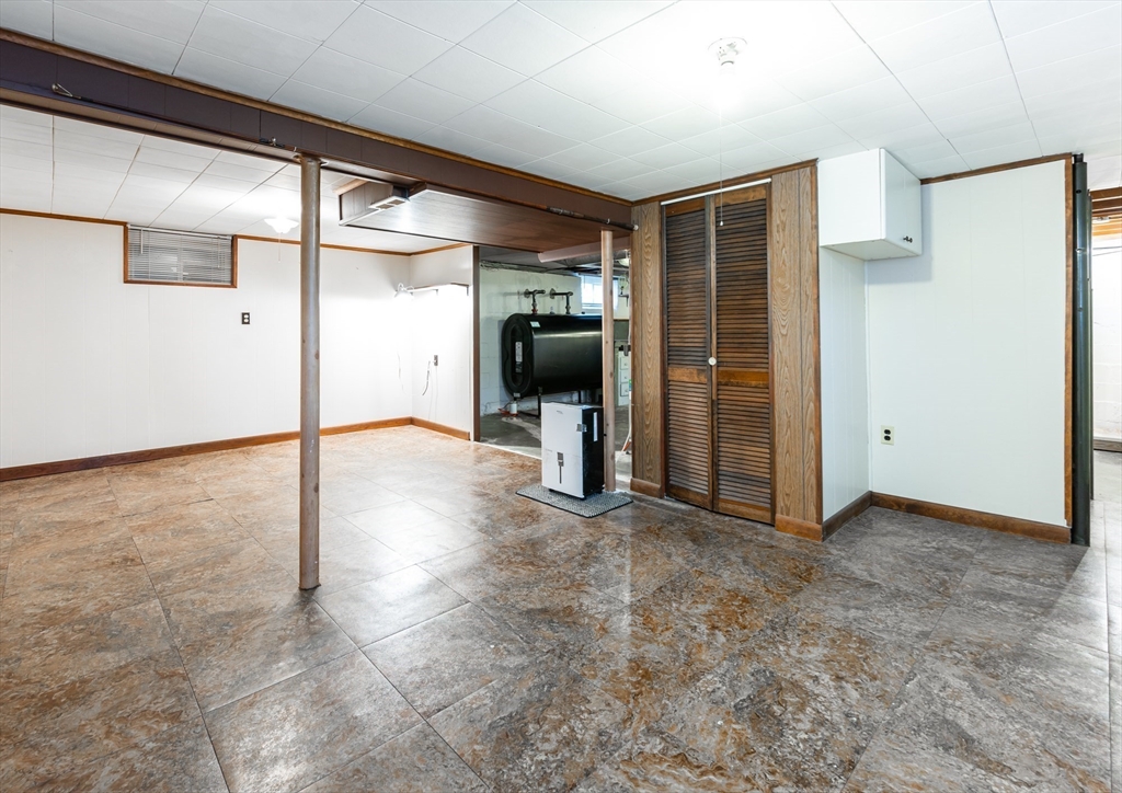 11 Colonial Road Woburn, MA 01801 - Photo 23 of 39 a view of a hallway with wooden shelves