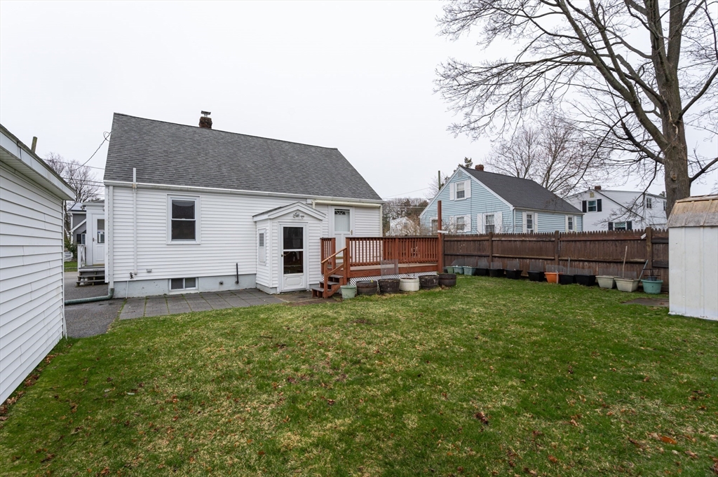 11 Colonial Road Woburn, MA 01801 - Photo 35 of 39 a view of a house with a backyard