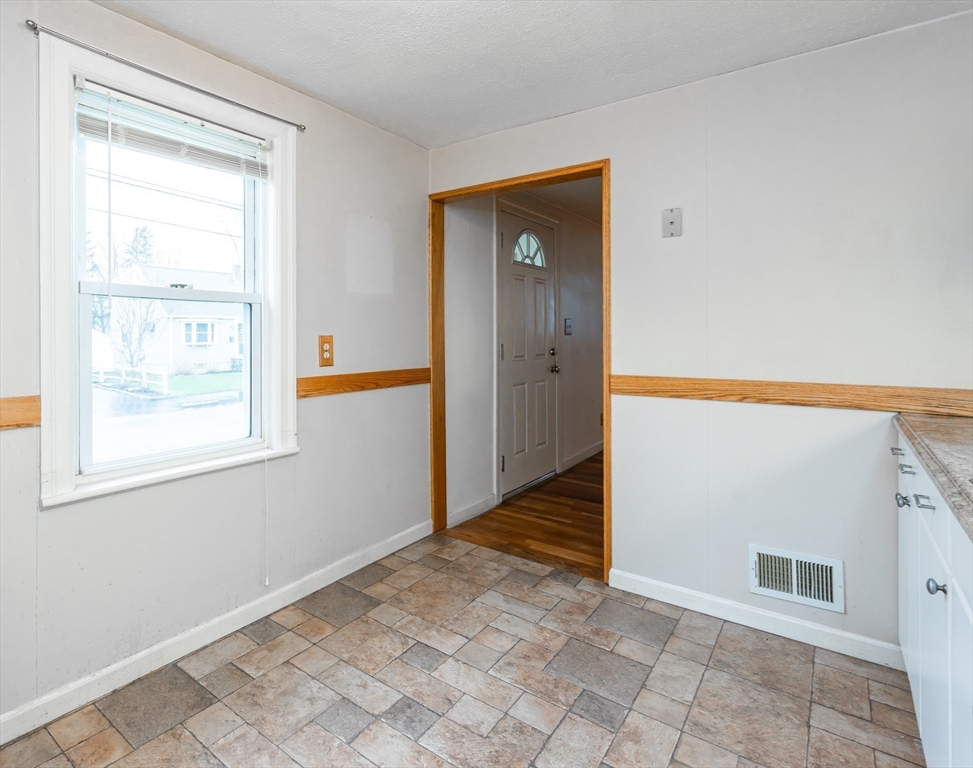 11 Colonial Road Woburn, MA 01801 - Photo 7 of 39 an empty room with a window