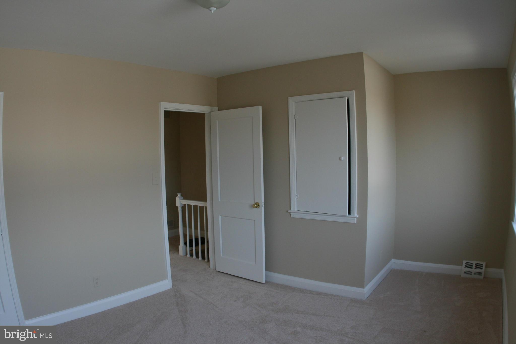503 Welbrook Road Baltimore, MD 21221 - Photo 12 of 24 an empty room with windows