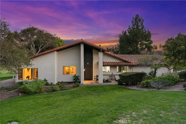 a house view with a garden space