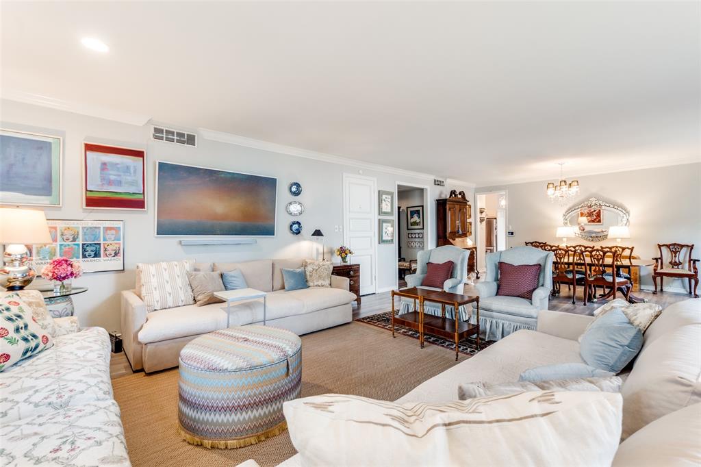 6306 Bandera Avenue, Unit B Dallas, TX 75225 - Photo 3 of 14 Spacious living area featuring light-toned wall finishes and crown molding