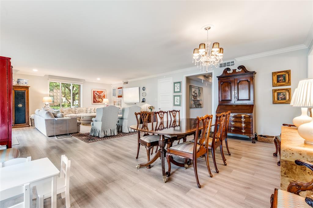 6306 Bandera Avenue, Unit B Dallas, TX 75225 - Photo 4 of 14 Open-concept living and dining areas featuring wood-finish flooring, recessed lighting, and crown molding
